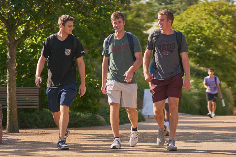 three students walking to class