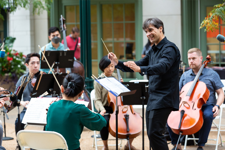 Conductor leading the orchestra