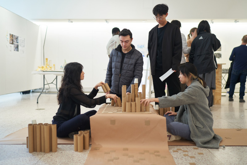 Architecture students building a project.